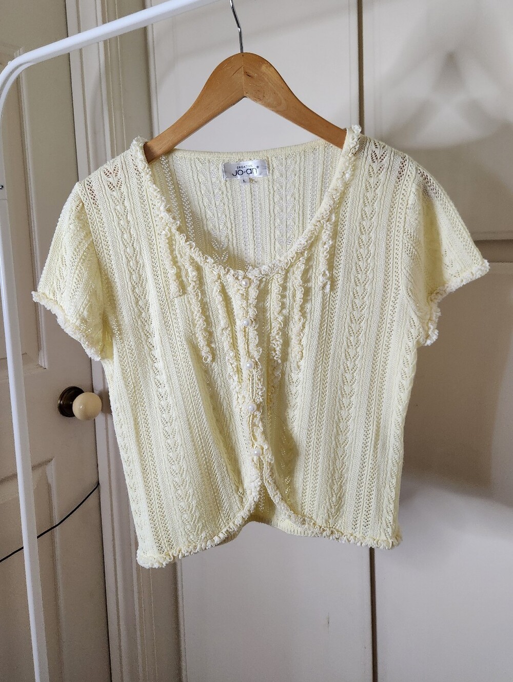 Joan pastel yellow knitted short sleeves cardigan with ruffles and buttons